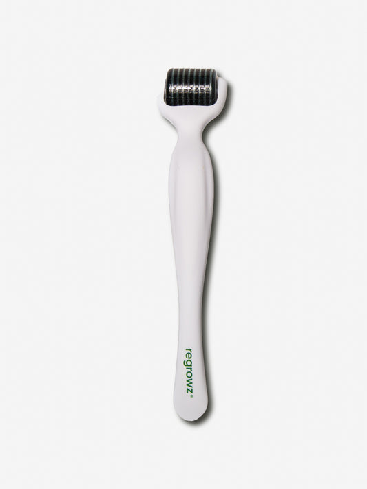 Regrowz  Complete Miracle Hair Kit white dermaroller with cylindrical needle head and branded handle on a plain white background.